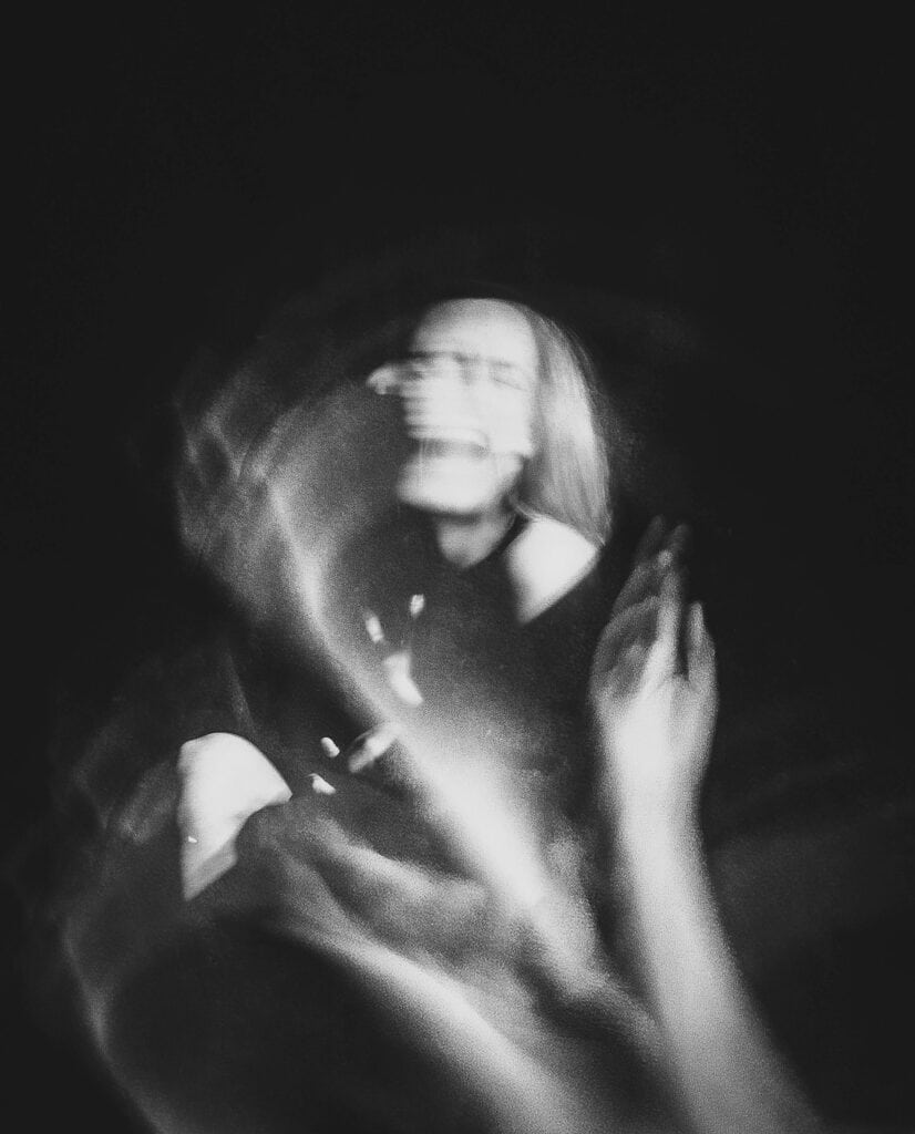 pexels-photo-33023550 - Softwire An motion blur black and white photo of a woman moving.